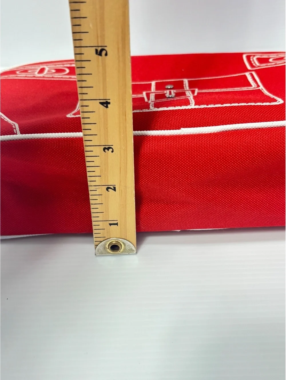 Clinique Red Canvas Cosmetic Bag with White Image Stitching and Zipper Closure